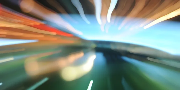 A long exposure at night, with streaks of light converging on the right edge.